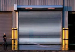 commercial rolling door in the side of a large building.